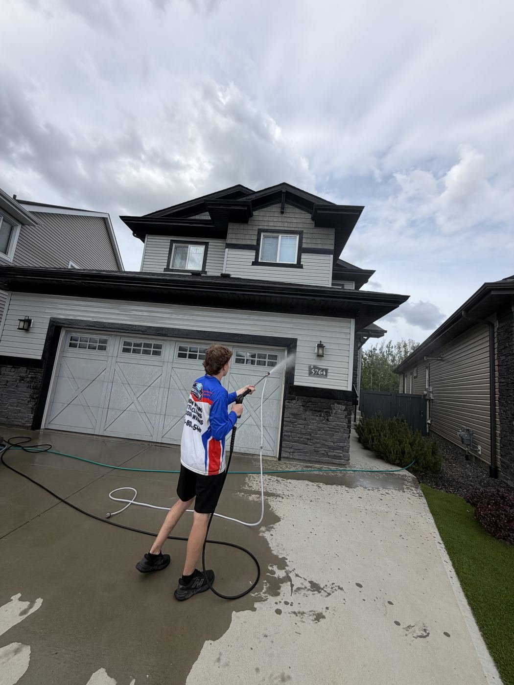 Pressure washing a residential driveway in Edmonton